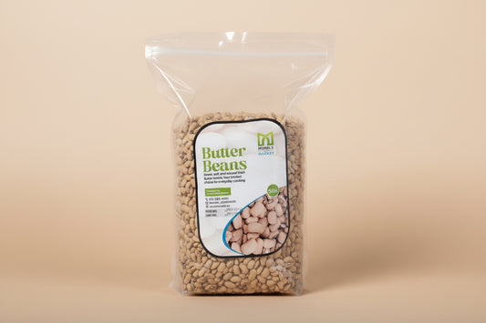 Packaged butter beans on a white tiled floor