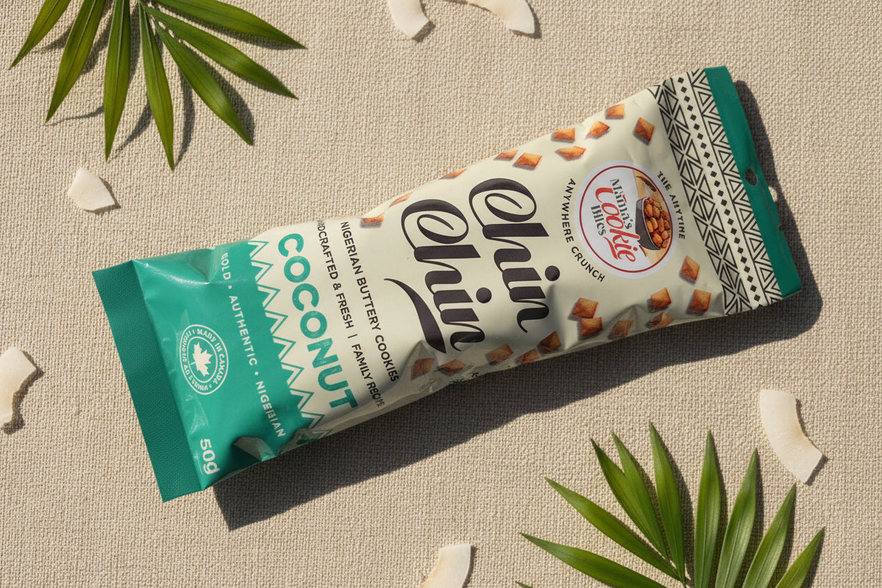 A single packaged chocolate cookie from the brand Chin Chin, specifically a Coconut flavor, lying on a textured wooden surface.